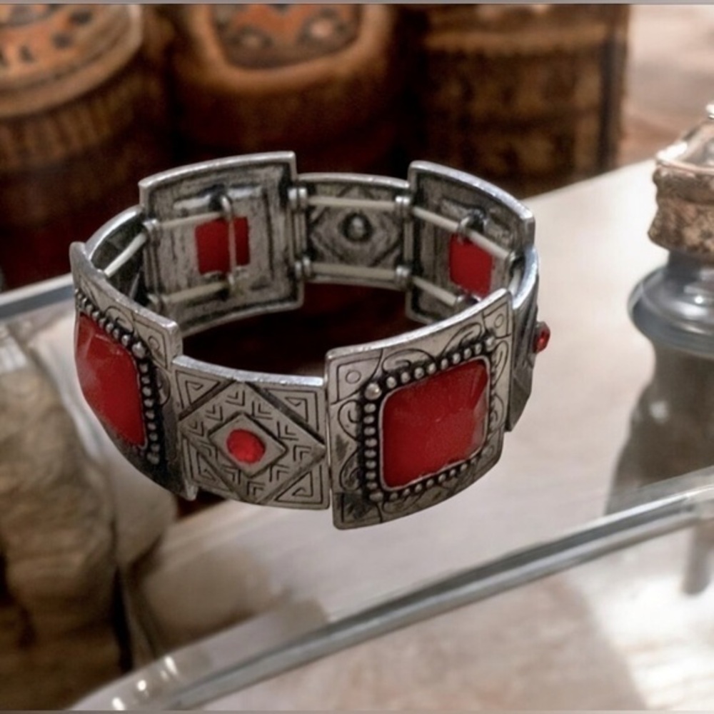 South western style stretch bracelet  in gunmetal w/ red resin stones.